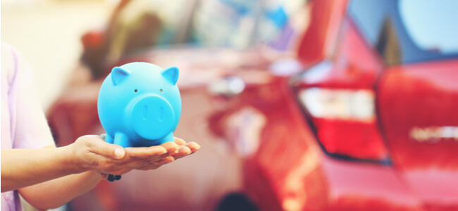 savings piggy bank on the background car